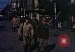 Image of U.S. sailors in Japanese city downtown Nagasaki Japan, 1945, second 57 stock footage video 65675055940