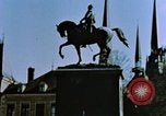 Image of civilians in street square Luxembourg, 1945, second 8 stock footage video 65675056170