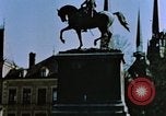 Image of civilians in street square Luxembourg, 1945, second 9 stock footage video 65675056170