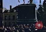 Image of civilians in street square Luxembourg, 1945, second 12 stock footage video 65675056170