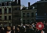 Image of civilians in street square Luxembourg, 1945, second 14 stock footage video 65675056170