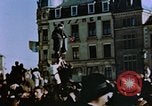 Image of civilians in street square Luxembourg, 1945, second 16 stock footage video 65675056170