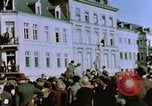 Image of civilians in street square Luxembourg, 1945, second 21 stock footage video 65675056170