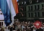 Image of civilians in street square Luxembourg, 1945, second 33 stock footage video 65675056170