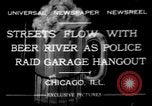 Image of police raid at garage Chicago Illinois USA, 1932, second 1 stock footage video 65675056184