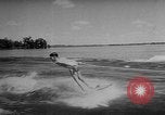 Image of water ski show Florida United States USA, 1957, second 22 stock footage video 65675056228