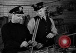 Image of police and firemen mend toys New York United States USA, 1940, second 14 stock footage video 65675056288