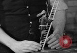 Image of police and firemen mend toys New York United States USA, 1940, second 19 stock footage video 65675056288