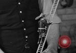 Image of police and firemen mend toys New York United States USA, 1940, second 22 stock footage video 65675056288
