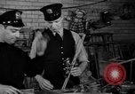 Image of police and firemen mend toys New York United States USA, 1940, second 25 stock footage video 65675056288