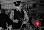 Image of police and firemen mend toys New York United States USA, 1940, second 26 stock footage video 65675056288