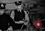 Image of police and firemen mend toys New York United States USA, 1940, second 27 stock footage video 65675056288