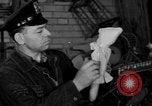 Image of police and firemen mend toys New York United States USA, 1940, second 33 stock footage video 65675056288