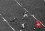 Image of Pro football match New York City USA, 1940, second 25 stock footage video 65675056289