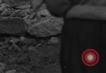 Image of Italian citizens in ruined village Italy, 1944, second 5 stock footage video 65675056390