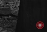 Image of Italian citizens in ruined village Italy, 1944, second 6 stock footage video 65675056390