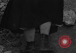 Image of Italian citizens in ruined village Italy, 1944, second 7 stock footage video 65675056390