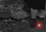 Image of Italian citizens in ruined village Italy, 1944, second 8 stock footage video 65675056390