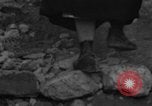 Image of Italian citizens in ruined village Italy, 1944, second 9 stock footage video 65675056390