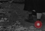Image of Italian citizens in ruined village Italy, 1944, second 10 stock footage video 65675056390