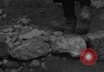 Image of Italian citizens in ruined village Italy, 1944, second 18 stock footage video 65675056390