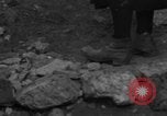 Image of Italian citizens in ruined village Italy, 1944, second 19 stock footage video 65675056390
