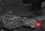 Image of Italian citizens in ruined village Italy, 1944, second 20 stock footage video 65675056390