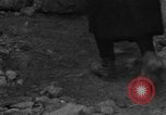 Image of Italian citizens in ruined village Italy, 1944, second 22 stock footage video 65675056390