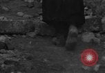 Image of Italian citizens in ruined village Italy, 1944, second 24 stock footage video 65675056390