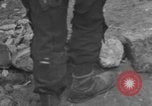 Image of Italian citizens in ruined village Italy, 1944, second 29 stock footage video 65675056390