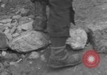 Image of Italian citizens in ruined village Italy, 1944, second 30 stock footage video 65675056390