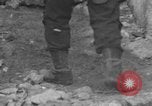 Image of Italian citizens in ruined village Italy, 1944, second 32 stock footage video 65675056390