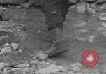 Image of Italian citizens in ruined village Italy, 1944, second 33 stock footage video 65675056390