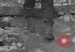 Image of Italian citizens in ruined village Italy, 1944, second 34 stock footage video 65675056390