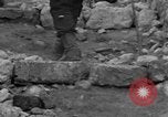 Image of Italian citizens in ruined village Italy, 1944, second 37 stock footage video 65675056390
