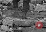 Image of Italian citizens in ruined village Italy, 1944, second 38 stock footage video 65675056390