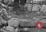 Image of Italian citizens in ruined village Italy, 1944, second 39 stock footage video 65675056390