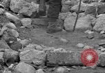 Image of Italian citizens in ruined village Italy, 1944, second 40 stock footage video 65675056390
