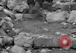 Image of Italian citizens in ruined village Italy, 1944, second 41 stock footage video 65675056390