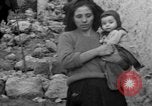 Image of Italian citizens in ruined village Italy, 1944, second 45 stock footage video 65675056390