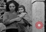 Image of Italian citizens in ruined village Italy, 1944, second 46 stock footage video 65675056390