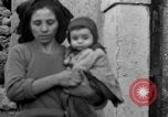 Image of Italian citizens in ruined village Italy, 1944, second 47 stock footage video 65675056390