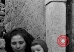 Image of Italian citizens in ruined village Italy, 1944, second 48 stock footage video 65675056390