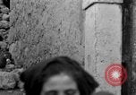 Image of Italian citizens in ruined village Italy, 1944, second 49 stock footage video 65675056390