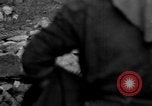 Image of Italian citizens in ruined village Italy, 1944, second 52 stock footage video 65675056390