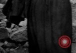 Image of Italian citizens in ruined village Italy, 1944, second 54 stock footage video 65675056390