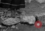 Image of Italian citizens in ruined village Italy, 1944, second 56 stock footage video 65675056390