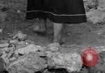 Image of Italian citizens in ruined village Italy, 1944, second 57 stock footage video 65675056390