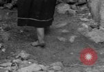 Image of Italian citizens in ruined village Italy, 1944, second 58 stock footage video 65675056390
