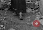 Image of Italian citizens in ruined village Italy, 1944, second 59 stock footage video 65675056390